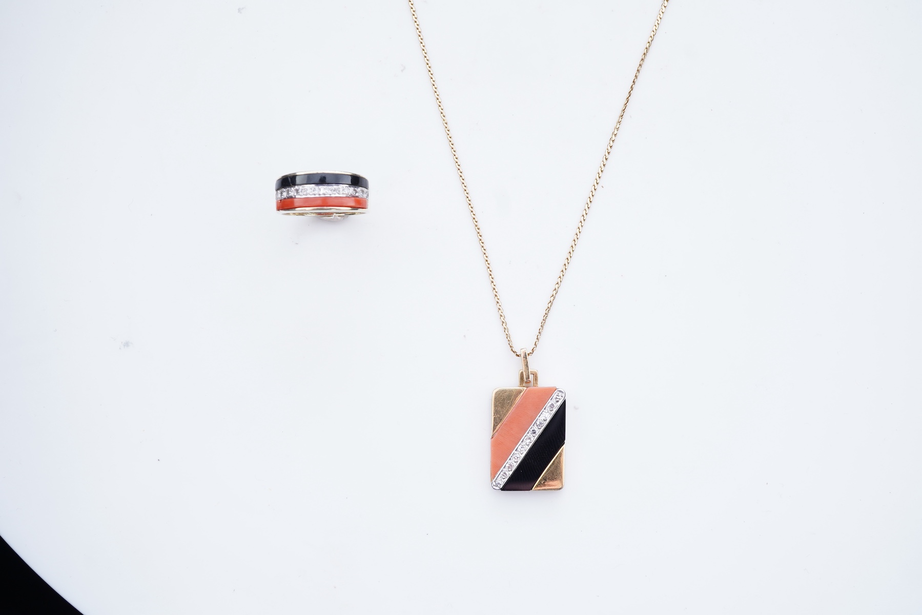 An onyx, coral and diamond demi-parure, circa 1976-7